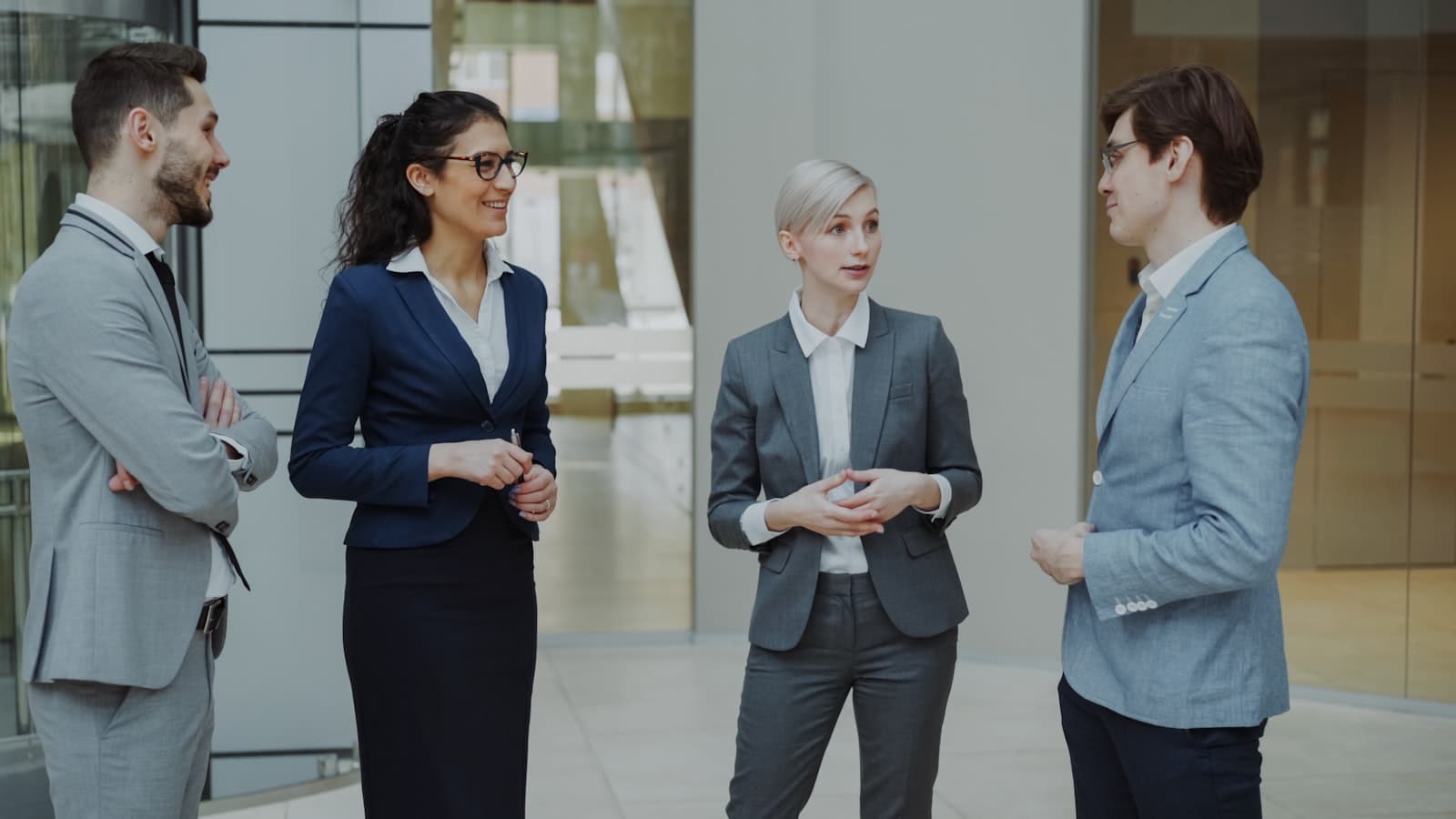 Business professionals in a modern office lobby